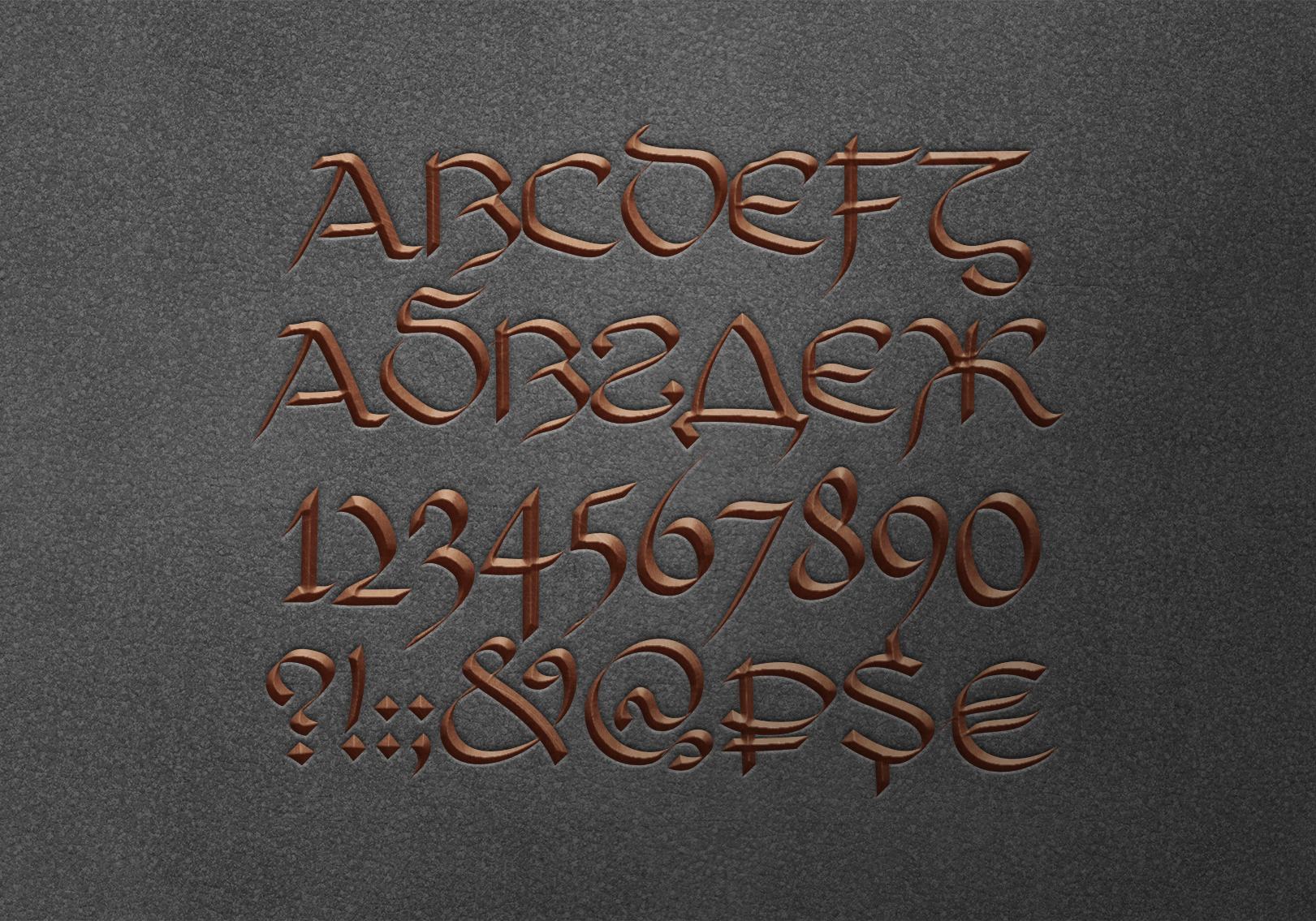 Tana Uncial SP - Font 1 20231112115337219-Engraved_Metallic_Logo_on_Felt_Background копия